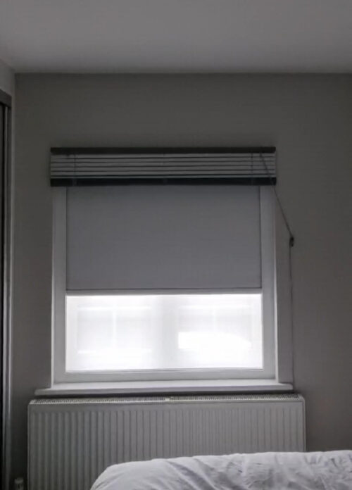 Blackout Roller Blind with Headrail, Side Rails and Bottom Rail fitted to provide darkness behind existing Wooden Venetian Blind in Central London