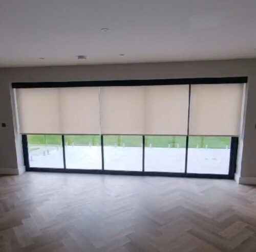 Electric Blinds fitted at Bifold Doors in North London. The blinds have been lowered to halfway.