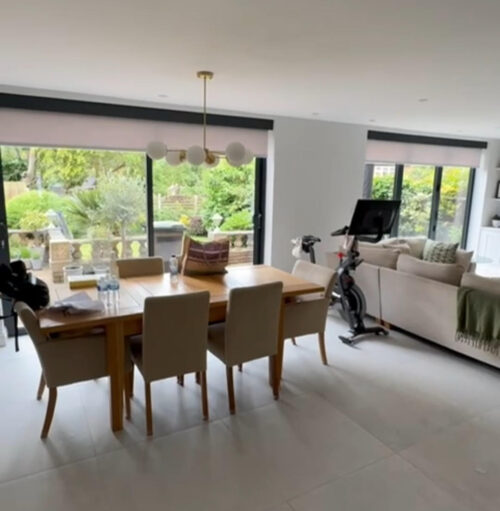 Sliding Doors and Bifold Doors in same space, identical electric roller blinds behind Fascia