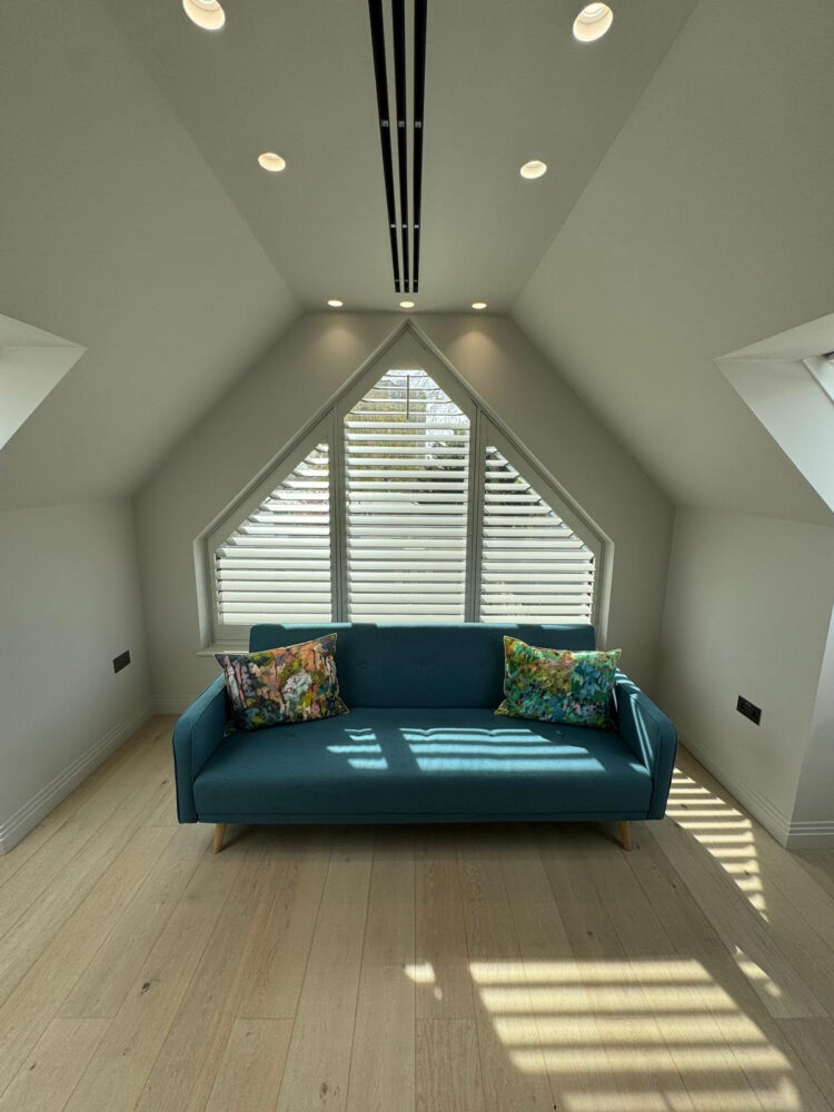 Triangular plantation shutters in East window