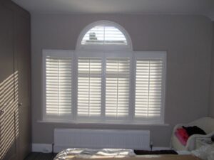 Venetian or Palladian window North London. A three panelled rectangular window with larger centre rectangle with a semi circular window above the centre panel - unusual we think