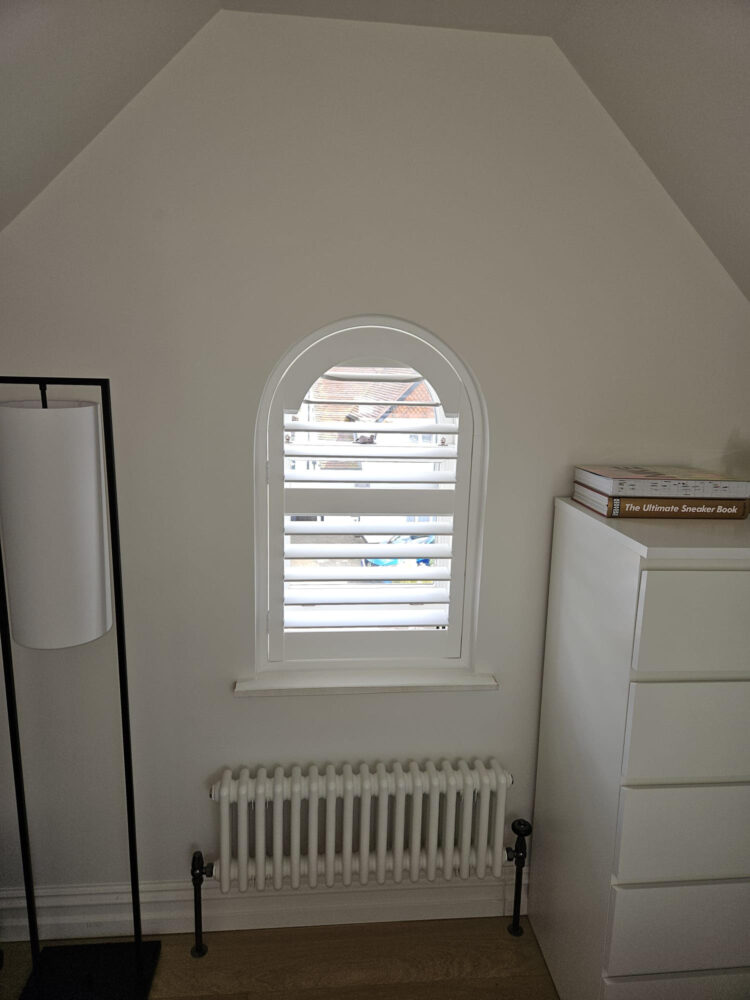 Special shape plantation shutter for arched window in East London