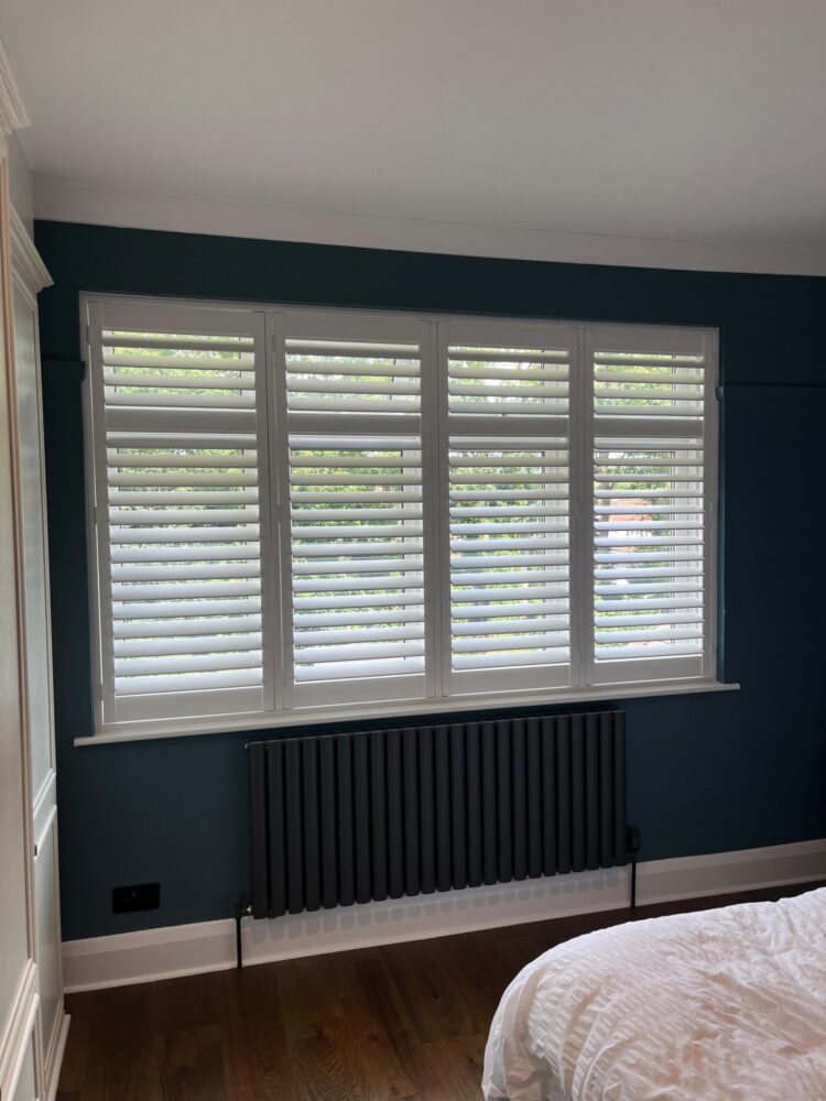 white wooden plantation shutters for painted bedroom North London